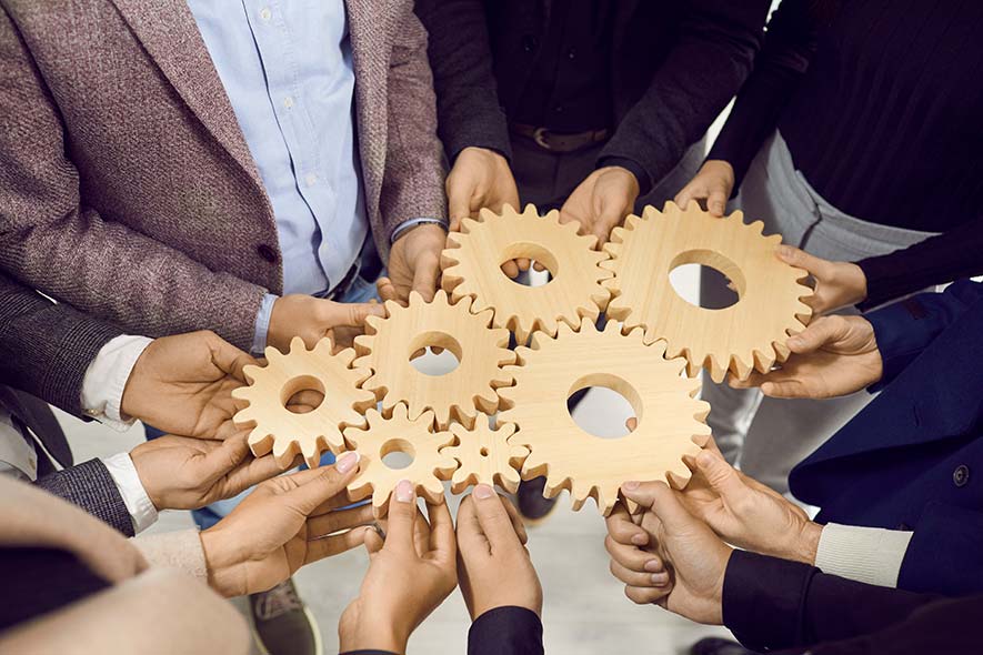 Interlocking gears symbolizing the integration of global business operations under a unified vision.