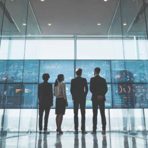 Business professionals analyzing data for AI-driven post-merger integration success